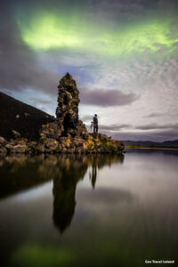 Aurora borealis green lights dancing over Mývatn Iceland